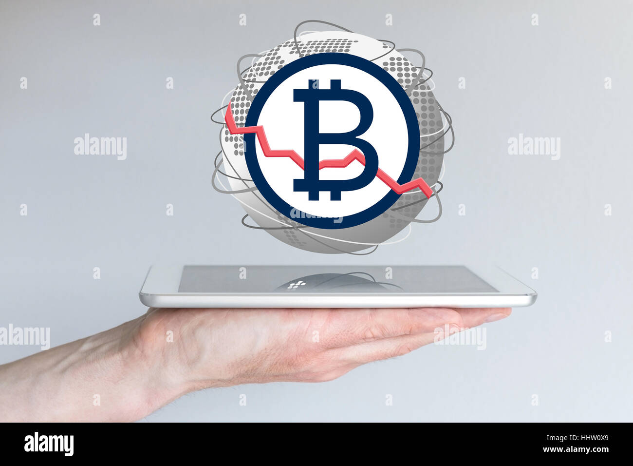 Baisse des taux de change devise bitcoin global concept with hand holding tablet Banque D'Images