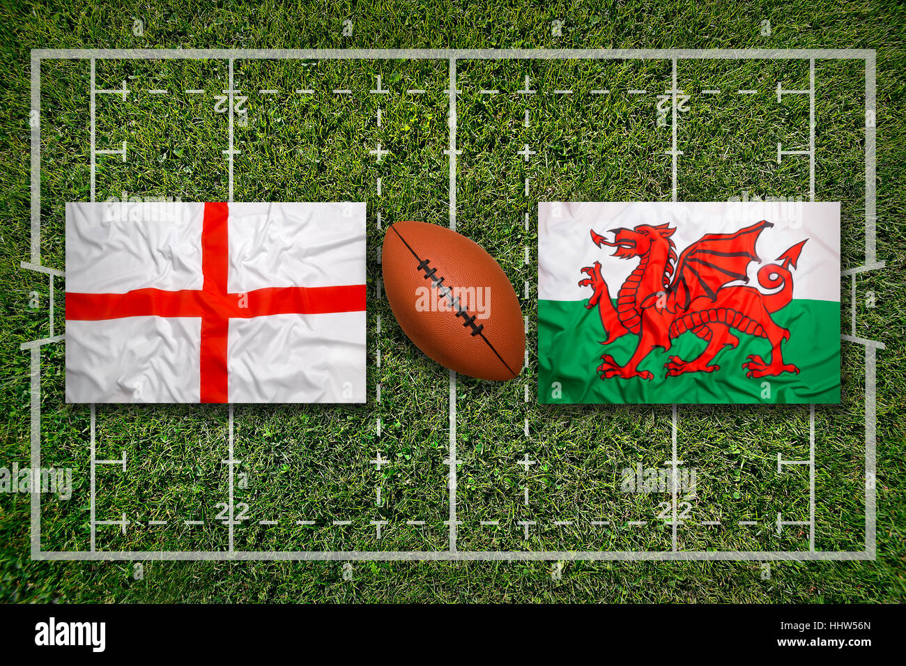 Angleterre vs Pays de Galles Les drapeaux sur terrain de rugby vert Banque D'Images