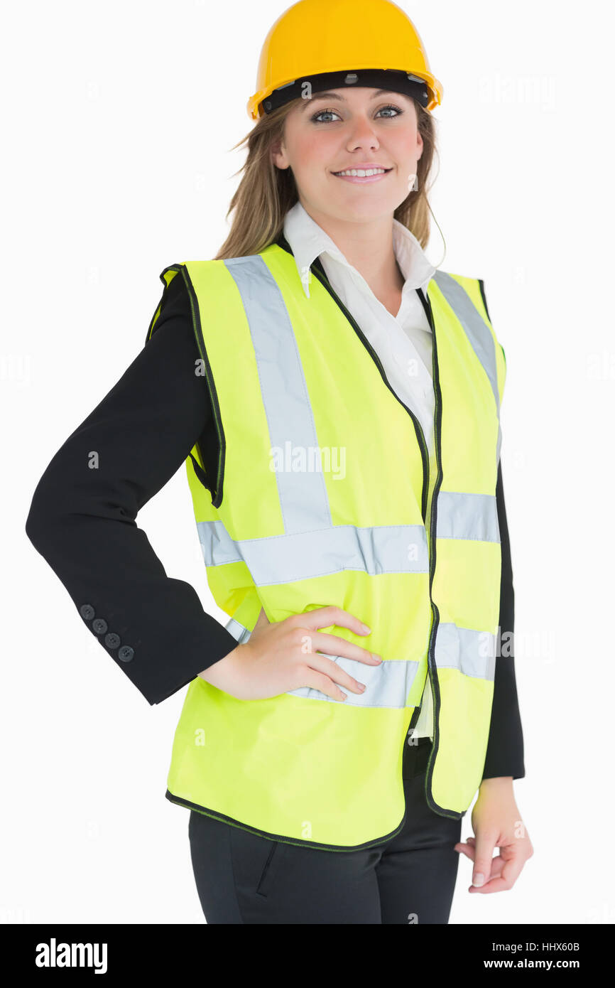 Smiling woman wearing vest et le casque d'un costume Banque D'Images