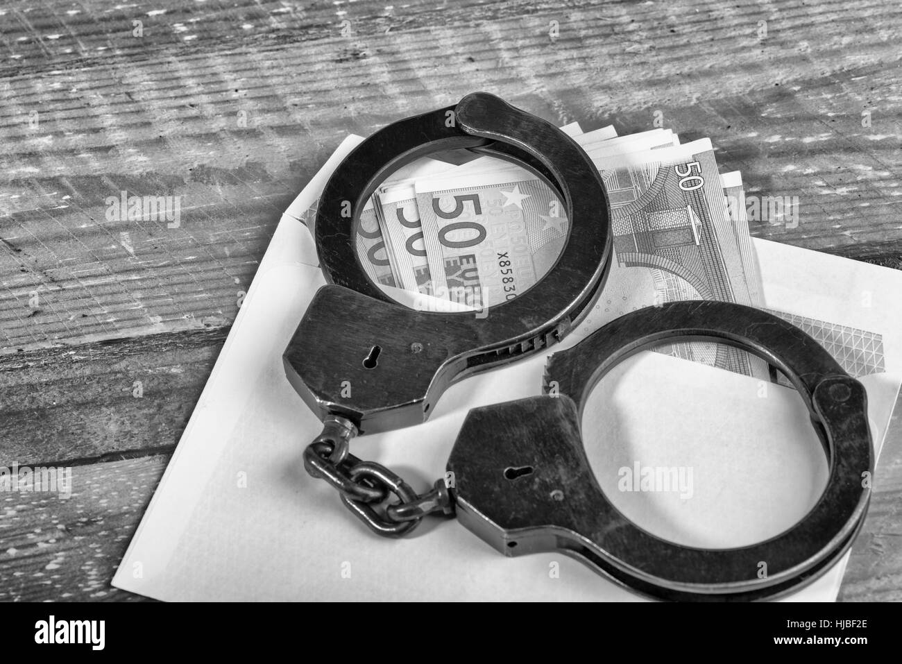 L'introduction des billets et des menottes Banque D'Images