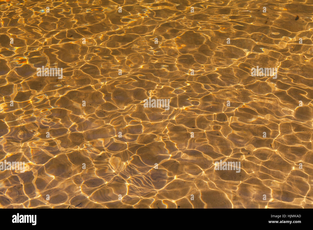 Golden Sand se répercutent dans de l'eau vague Résumé fond stock photo Banque D'Images