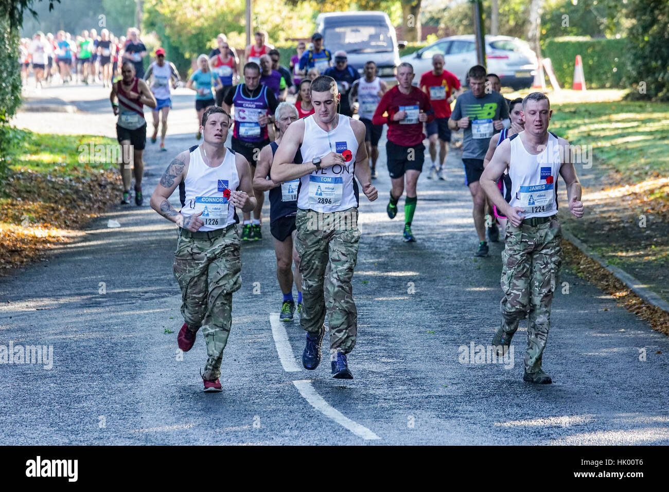 Un groupe de coureurs dans le Marathon de Chester soutenant la légion britannique Banque D'Images
