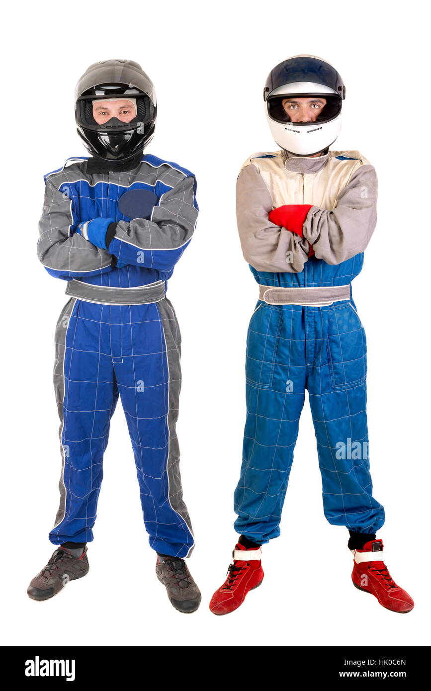 Les pilotes de course qui posent avec casque isolé dans White Banque D'Images
