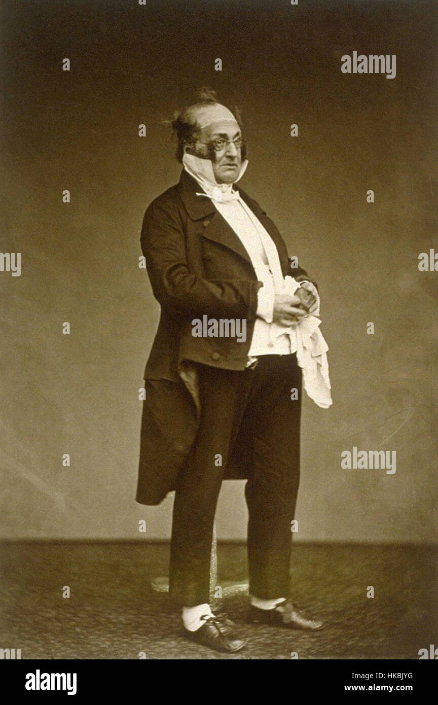 La photographie « Monnier jouant le rôle de Prudhomme » de Carjat capture l'acteur français Monnier en costume de Prudhomme, un personnage du théâtre français, reflétant la tradition théâtrale du XIXe siècle. Banque D'Images