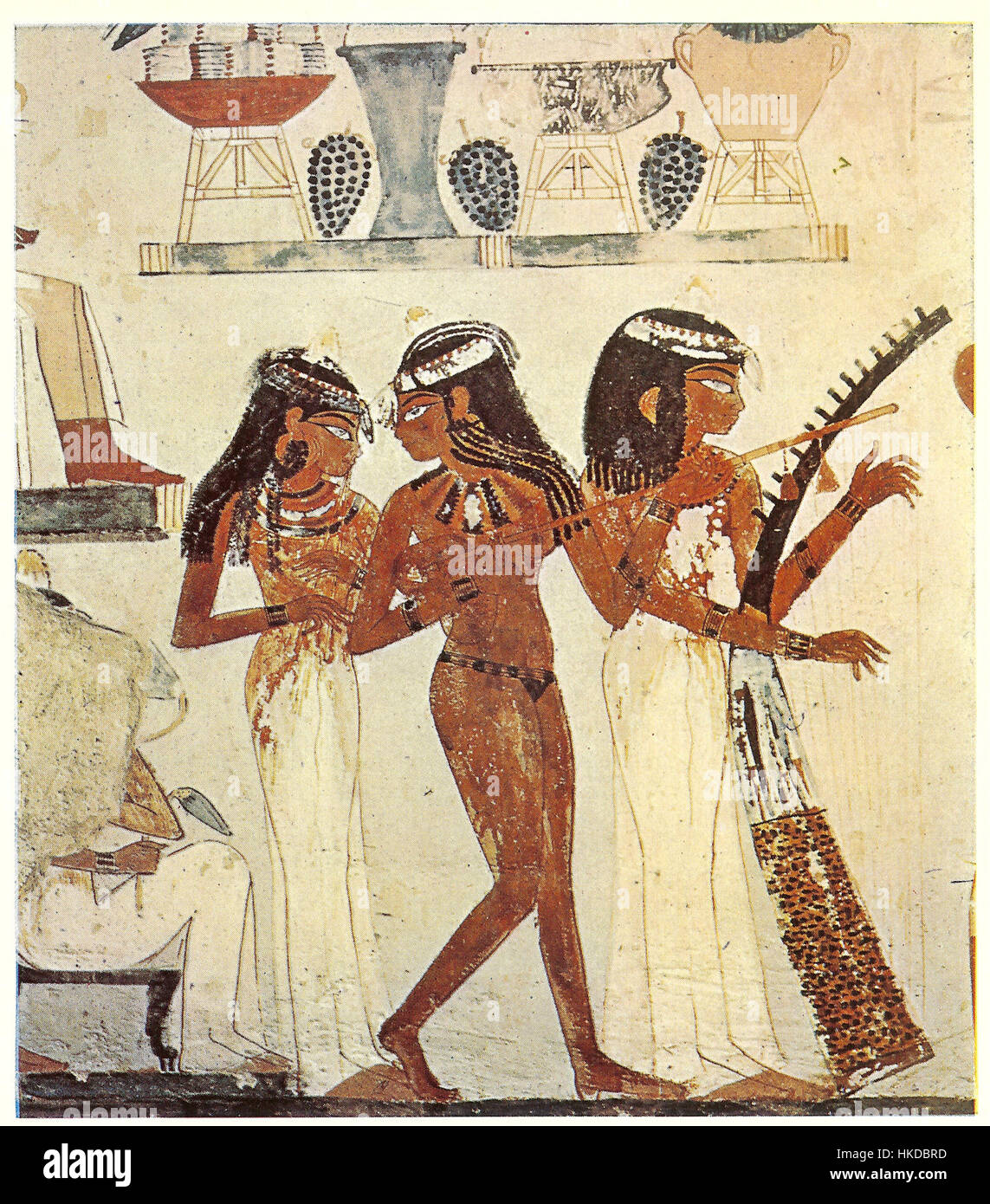Le tombeau de Nakht présente une peinture détaillée de trois musiciens, mettant en valeur l'art et la culture égyptiens antiques à travers la représentation d'instruments de musique et de personnages historiques. Banque D'Images