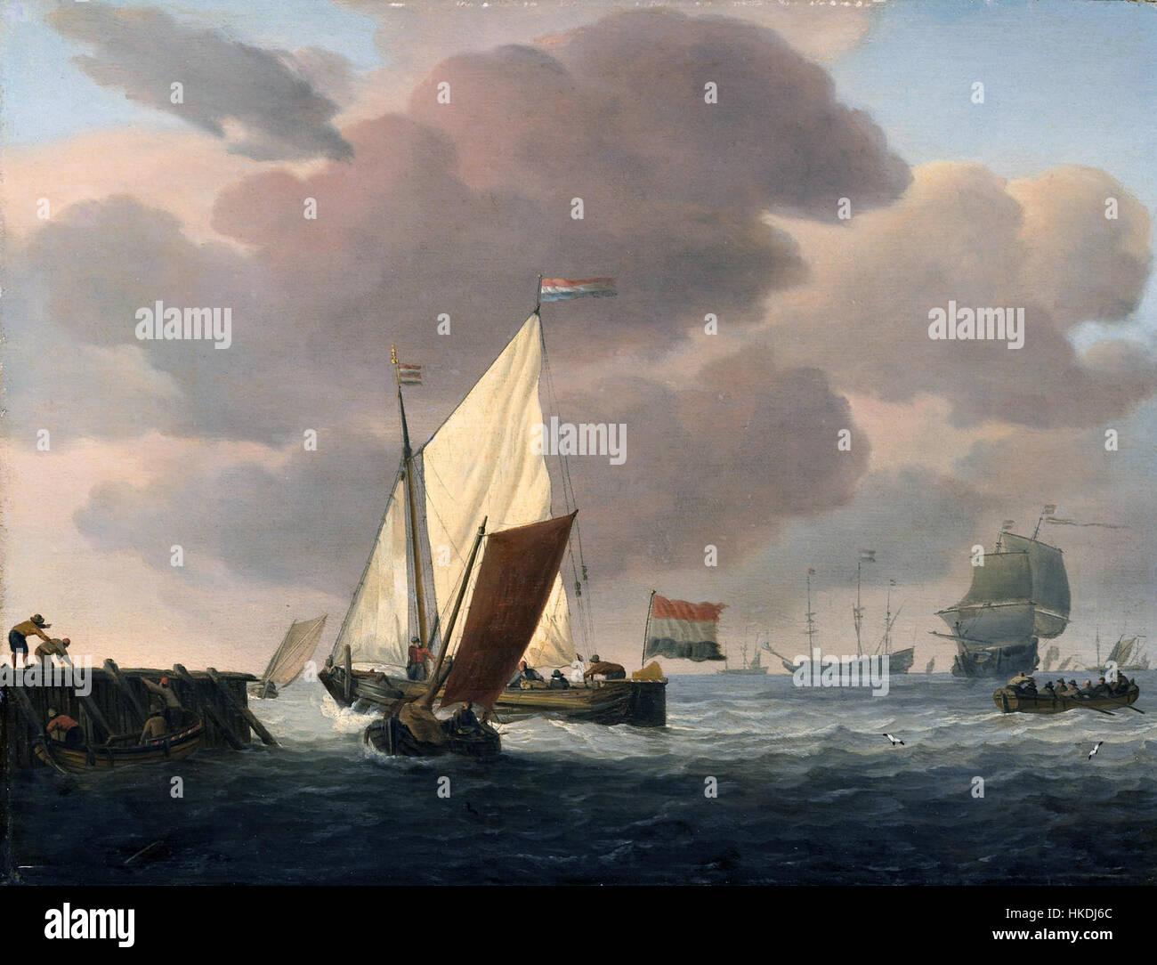 Ce paysage marin de Willem van de Velde II représente des navires sur la côte par temps venteux. Le détail des vagues et des voiles met en évidence la maîtrise de l'art marin par l'artiste, caractéristique de sa carrière au XVIIe siècle. Banque D'Images