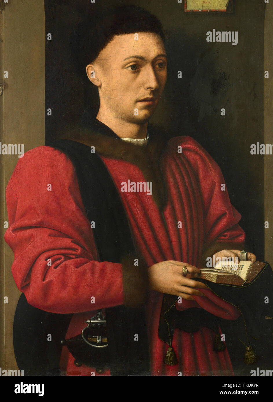 Le Portrait d'un jeune homme de Petrus Christus, peint vers 1460, montre la maîtrise de l'artiste dans la représentation de la forme humaine et des détails. La peinture reflète l'accent mis par la Renaissance du Nord sur le réalisme et la profondeur émotionnelle. Banque D'Images
