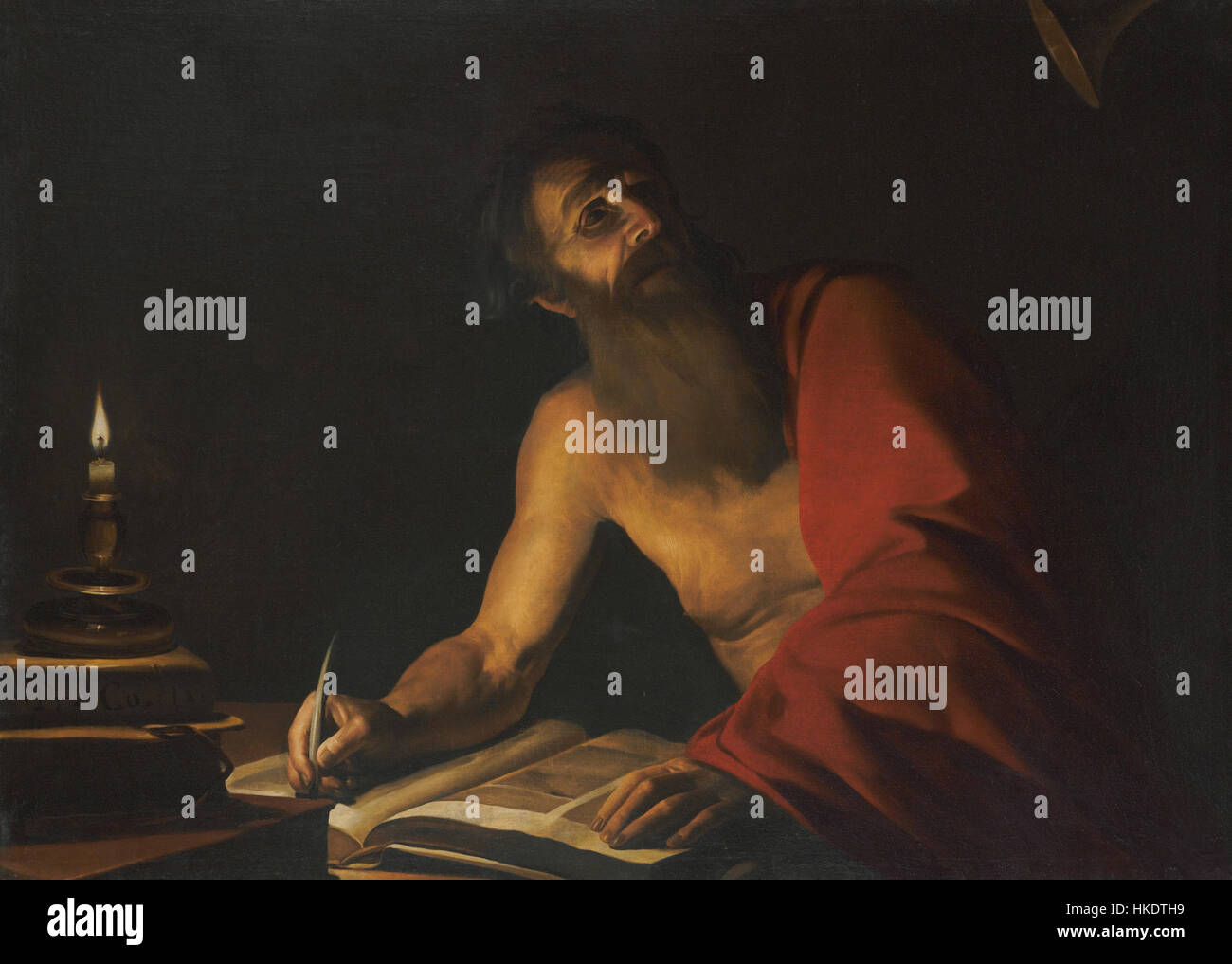 'Saint Jérôme lisant aux chandelles' est une peinture attribuée à Trophime Bigot, montrant le saint absorbé par la lecture de son écriture aux chandelles. L'œuvre reflète la nature calme et contemplative de la dévotion du saint. Banque D'Images