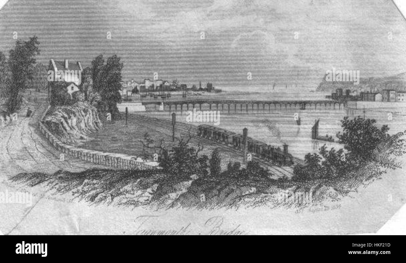 'BroadGaugeTeign' est une œuvre d'art mettant en vedette un train à voie large traversant la rivière Teign. La peinture illustre le développement rapide de l’ère industrielle et l’importance du transport ferroviaire dans les régions de liaison au cours du XIXe siècle. Banque D'Images