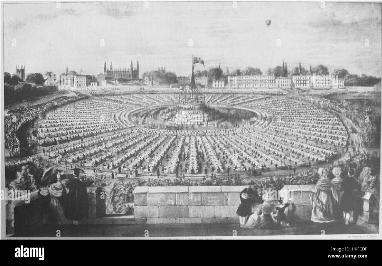 Ce tableau représente la fête du couronnement à Parker's Piece, un parc public emblématique de Cambridge, en Angleterre. L'œuvre capture l'atmosphère festive entourant la célébration royale, soulignant l'importance de l'événement dans l'histoire britannique. Banque D'Images