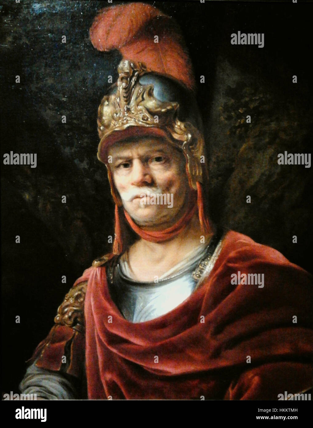 Cette peinture, intitulée 'Man in Golden Helmet', met en valeur un homme orné d'un casque doré. La pièce est souvent associée à la période baroque, caractérisée par des détails complexes et un éclairage dramatique. Banque D'Images