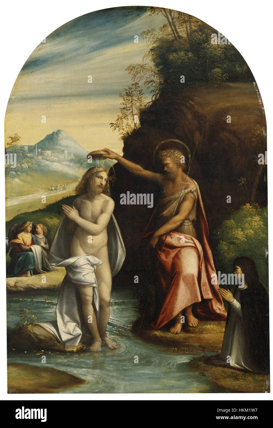 Cette peinture du XVIe siècle de Benvenuto Tisi da Garofalo représente le baptême du Christ, un événement important de la théologie chrétienne. La tempera sur panneau a été créée entre 1520-1530 et reflète le style artistique de la Renaissance. Banque D'Images