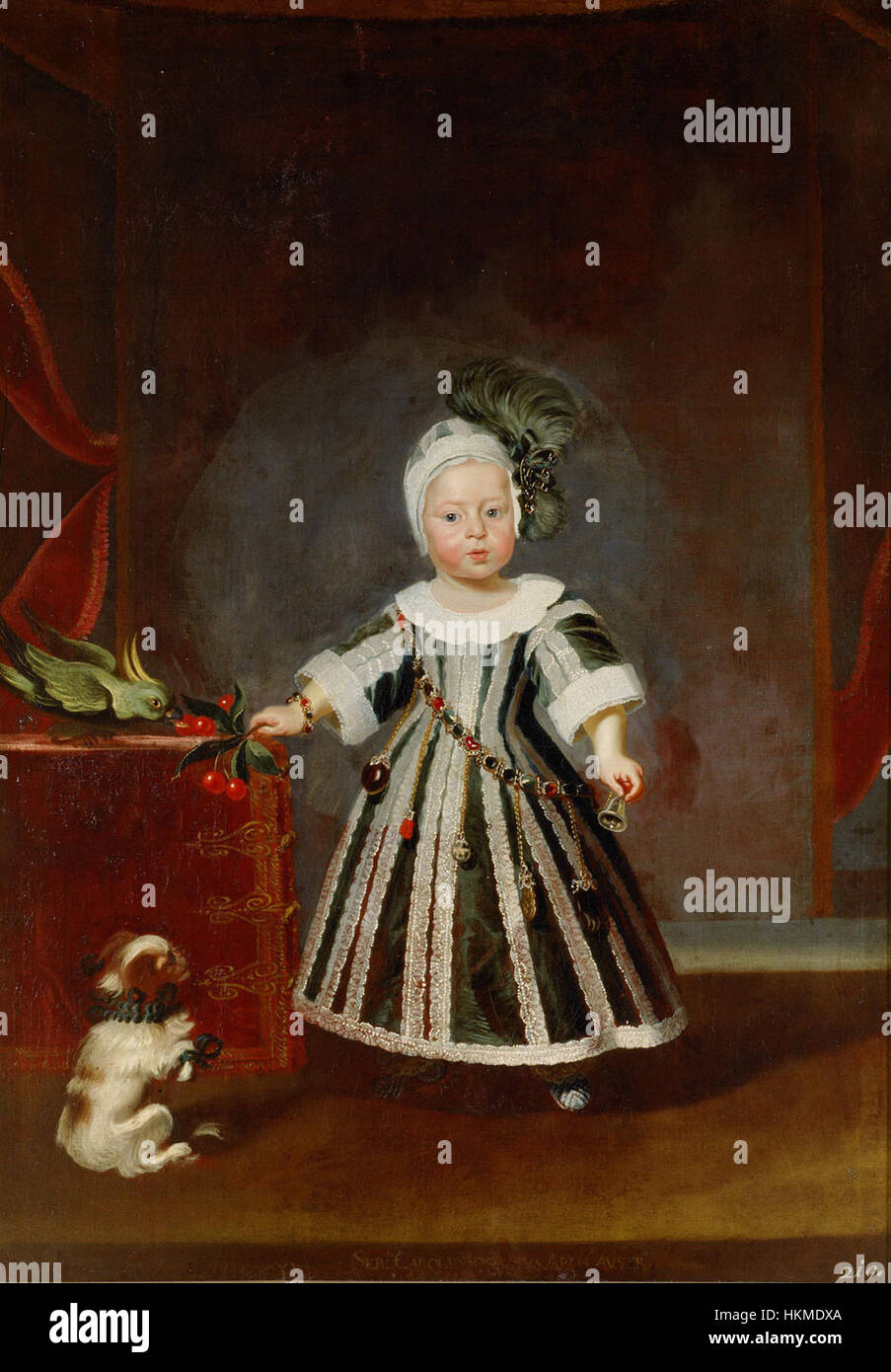 Ce portrait de Frans Luycx représente l'archiduc Karl Joseph, montré à l'âge d'un an et demi, entouré de chiots et d'un cacatoès. La peinture reflète l'aristocratie européenne et la fascination pour la nature et l'enfance. Banque D'Images