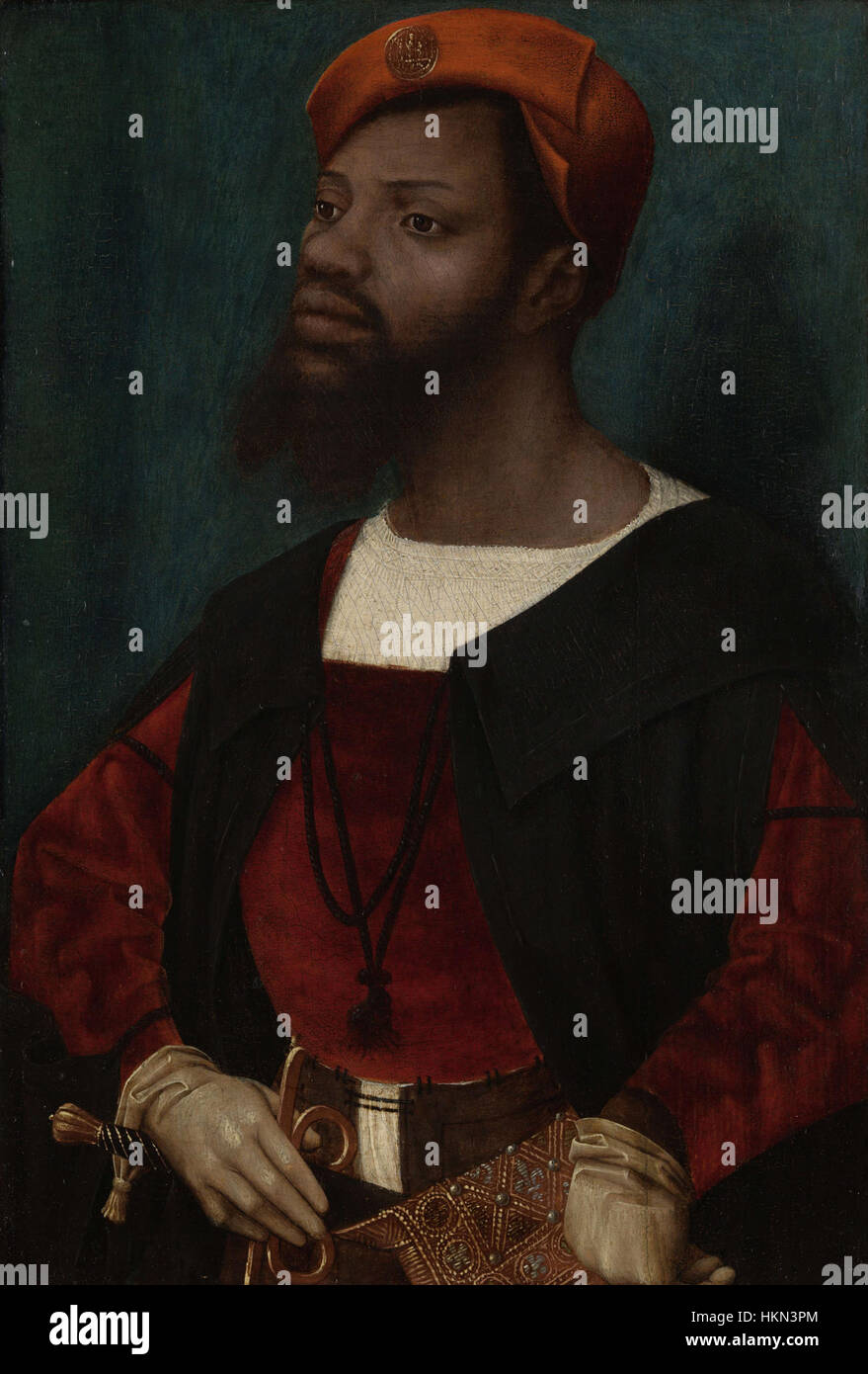 Ce portrait du XVIe siècle réalisé par Jan Mostaert représente un homme africain, mettant en évidence l'intérêt croissant pour la diversité des portraits européens pendant la Renaissance. La peinture reflète une conscience plus large des cultures non européennes au cours de la période. Banque D'Images