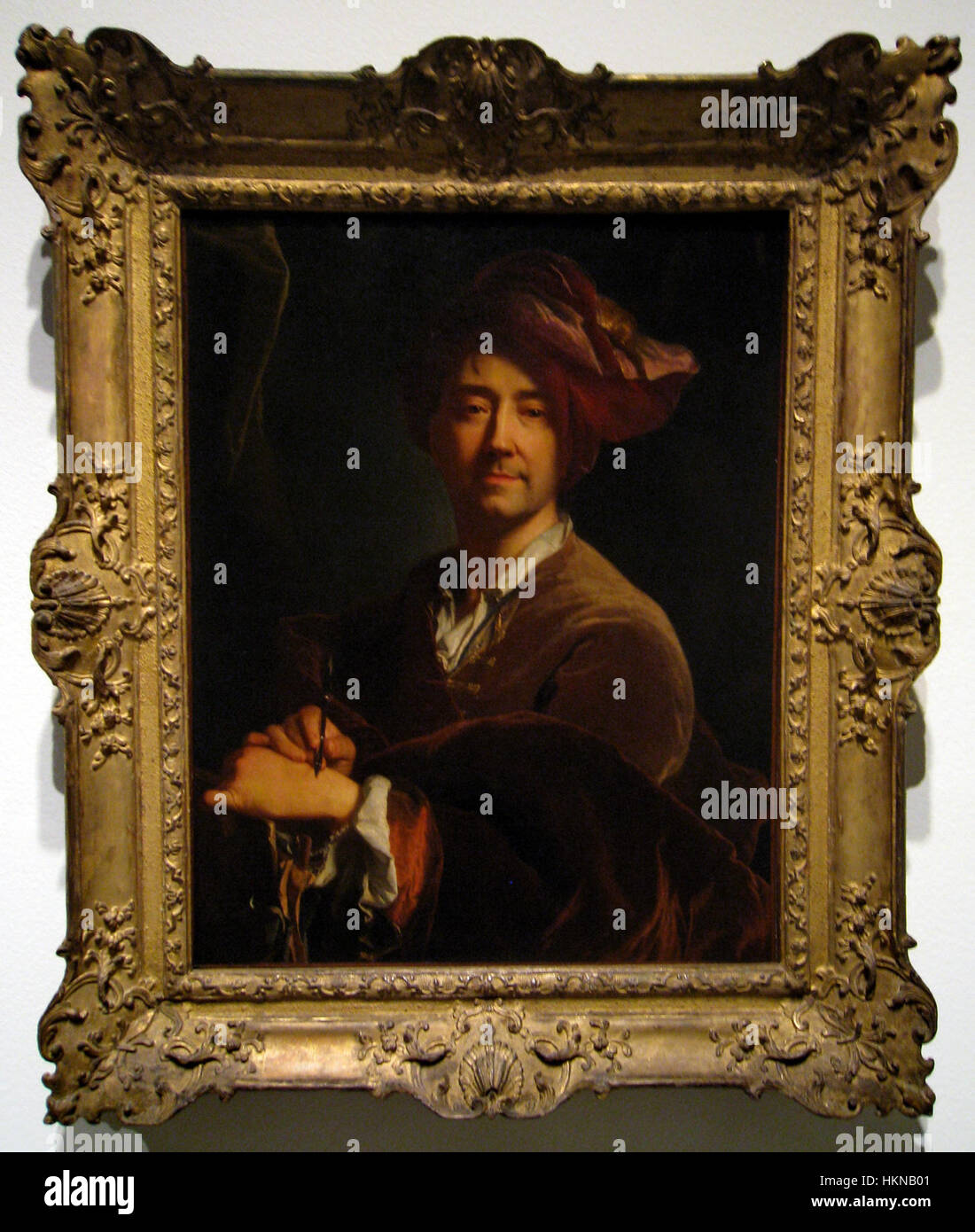 L’autoportrait de Jacint Rigau démontre sa maîtrise de la capture de la forme humaine. La peinture reflète son style unique, mélangeant des techniques traditionnelles avec une touche personnelle, ce qui en fait une pièce importante de sa carrière artistique. Banque D'Images