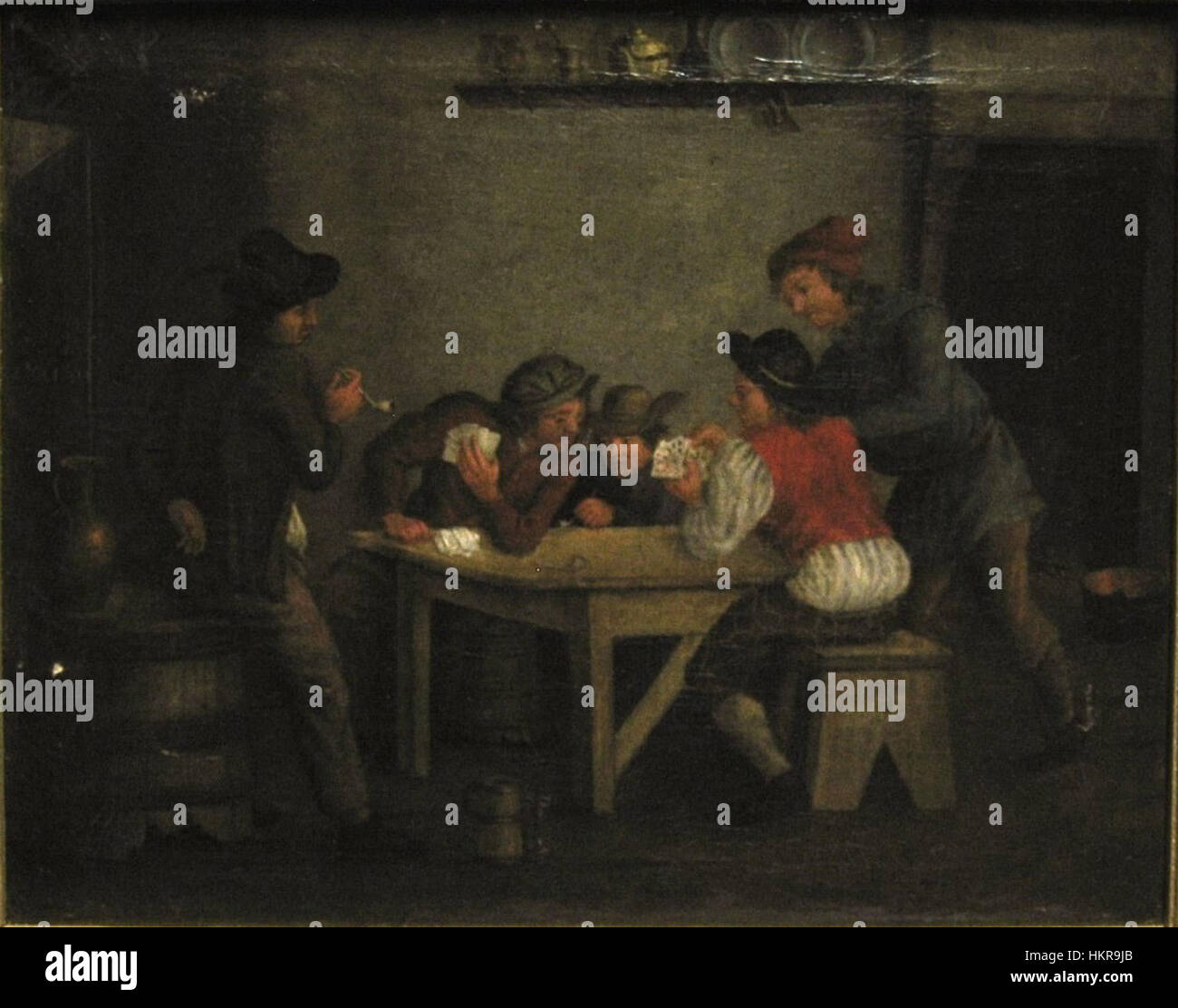 Les joueurs de cartes de Johannes Hubertus Cuypers illustrent une scène de personnes engagées dans un jeu de cartes, capturant l'élément humain des loisirs et de l'interaction sociale au XVIIe siècle. La composition de la peinture et l’utilisation de la lumière reflètent la maîtrise des techniques baroques par l’artiste. Banque D'Images