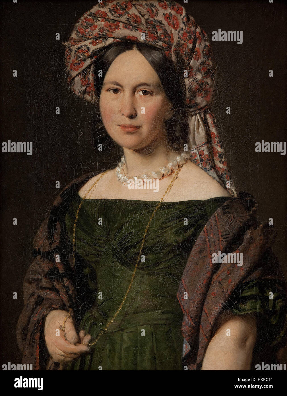 Ce portrait, peint par L. Caravaque, représente Cathrine Jensen, l'épouse de l'artiste, vêtue d'un turban. La peinture du XVIIIe siècle capture l'élégance de l'époque, reflétant des thèmes personnels et artistiques dans un style détaillé et raffiné. Banque D'Images