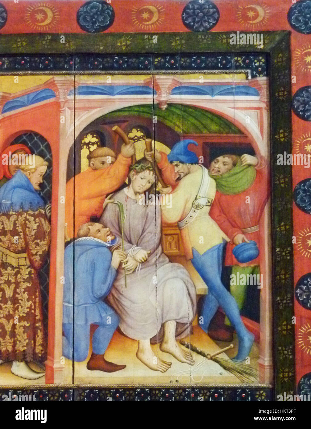 Le 'Dornenkrönung' (Couronne d'épines) de Konrad von Soest est est un retable gothique représentant la couronne d'épines placée sur la tête du Christ. Cette œuvre fait partie du Wildunger Altarpiece, mettant en valeur un symbolisme religieux vif et des techniques artistiques européennes du XIVe siècle. Banque D'Images
