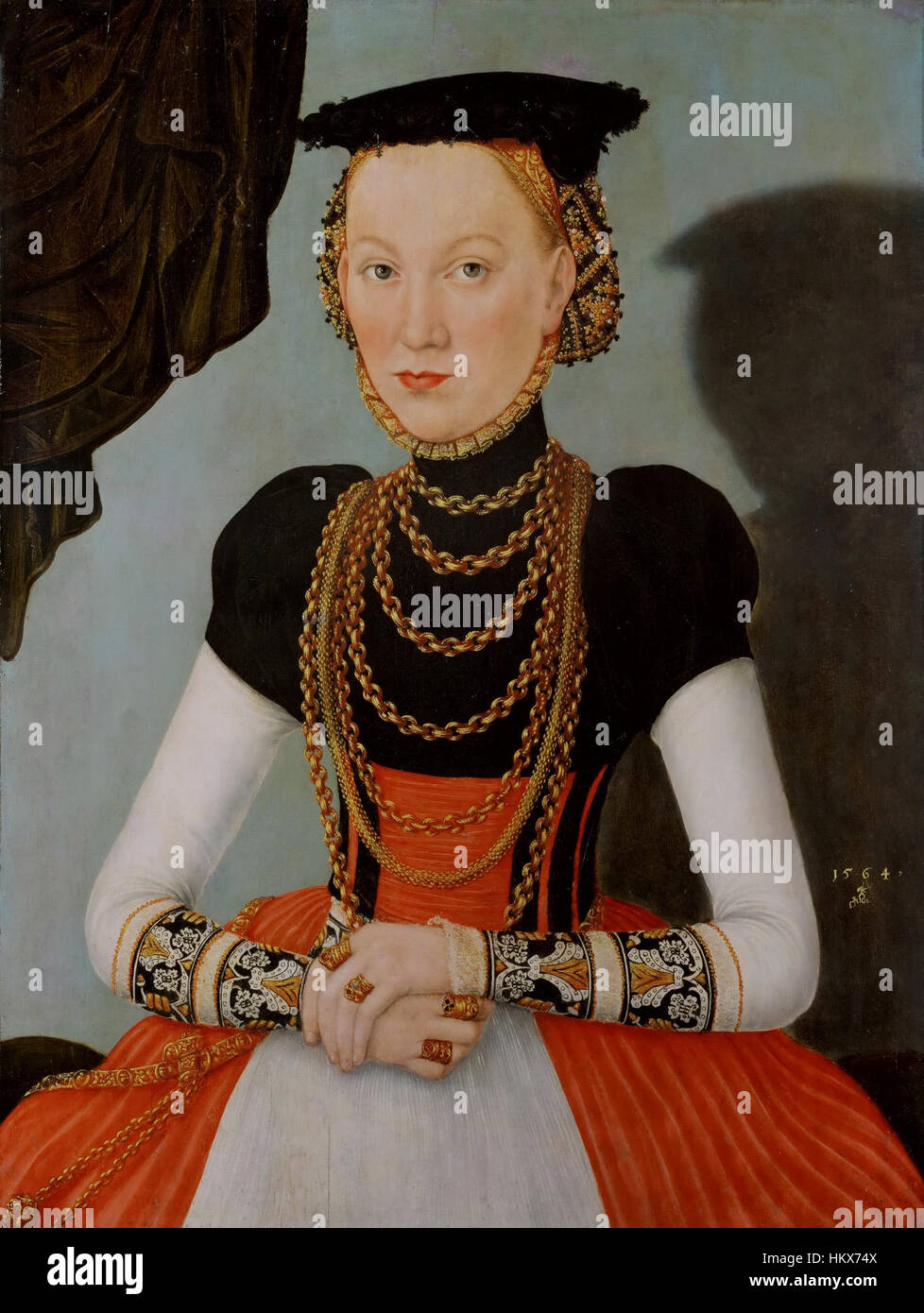 « Weibliches Bildnis » (1564) de Lucas Cranach le jeune est un portrait de la Renaissance qui met en évidence les traits détaillés d'une noble femme, avec des éléments symboliques qui reflètent le style et la période distinctifs de l'artiste. Banque D'Images