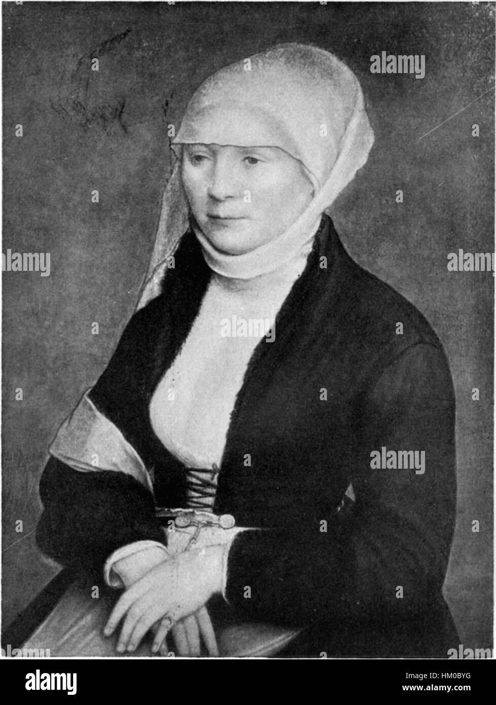 Cette œuvre en noir et blanc de Hans Holbein le jeune démontre son habileté dans le portrait et l'utilisation de contrastes frappants pour capturer l'essence de ses sujets. Holbein était connu pour ses détails méticuleux dans le rendu à la fois de l'apparence et du caractère des individus. Banque D'Images