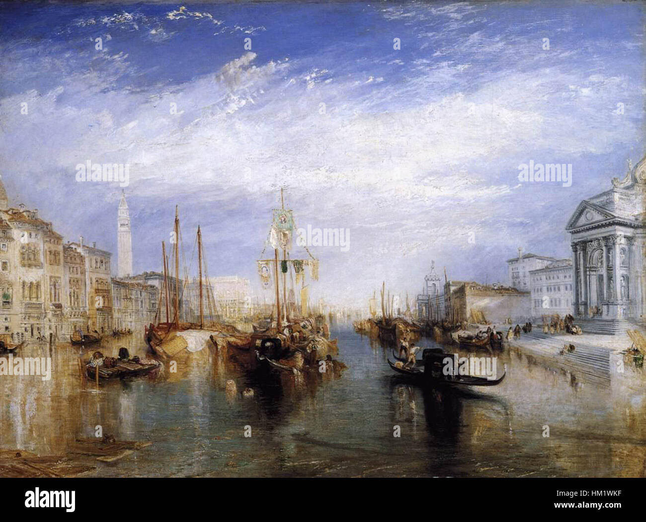 « Le Grand canal, Venise » de Joseph Mallord William Turner capture l'emblématique voie navigable vénitienne avec son utilisation caractéristique de la lumière et de la perspective atmosphérique. La peinture à l'huile met en valeur la beauté sereine de Venise, avec ses reflets sur l'eau et l'architecture complexe de la ville. Banque D'Images
