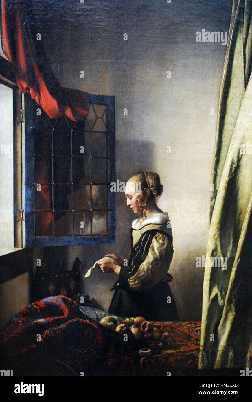 Johannes Vermeer - Jeune fille lisant une lettre par une fenêtre ouverte (c) 1657 Banque D'Images