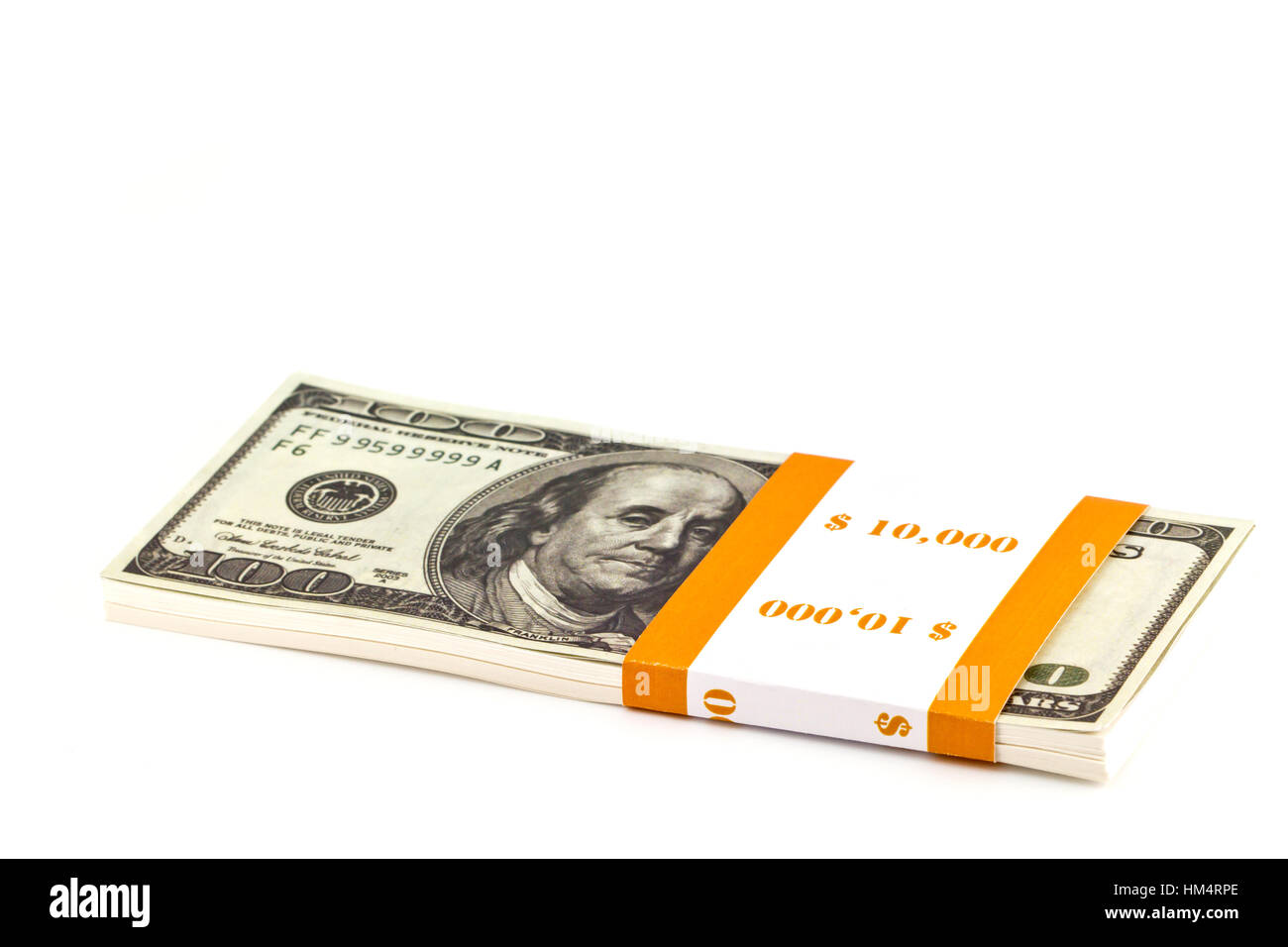 Dix mille dollars stacks sur le livre blanc Banque D'Images Dix mille dollars stacks sur le livre blanc Banque D'Images