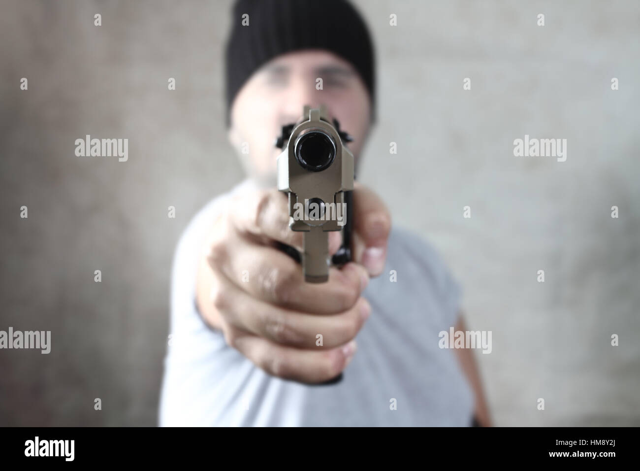 Killer avec une arme à feu Banque D'Images