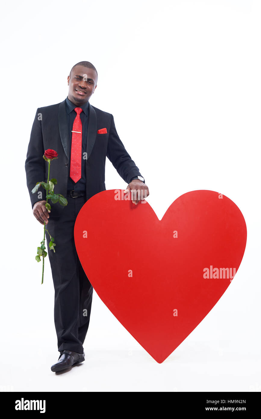 Man holding rose, présent pour la Saint-Valentin Banque D'Images