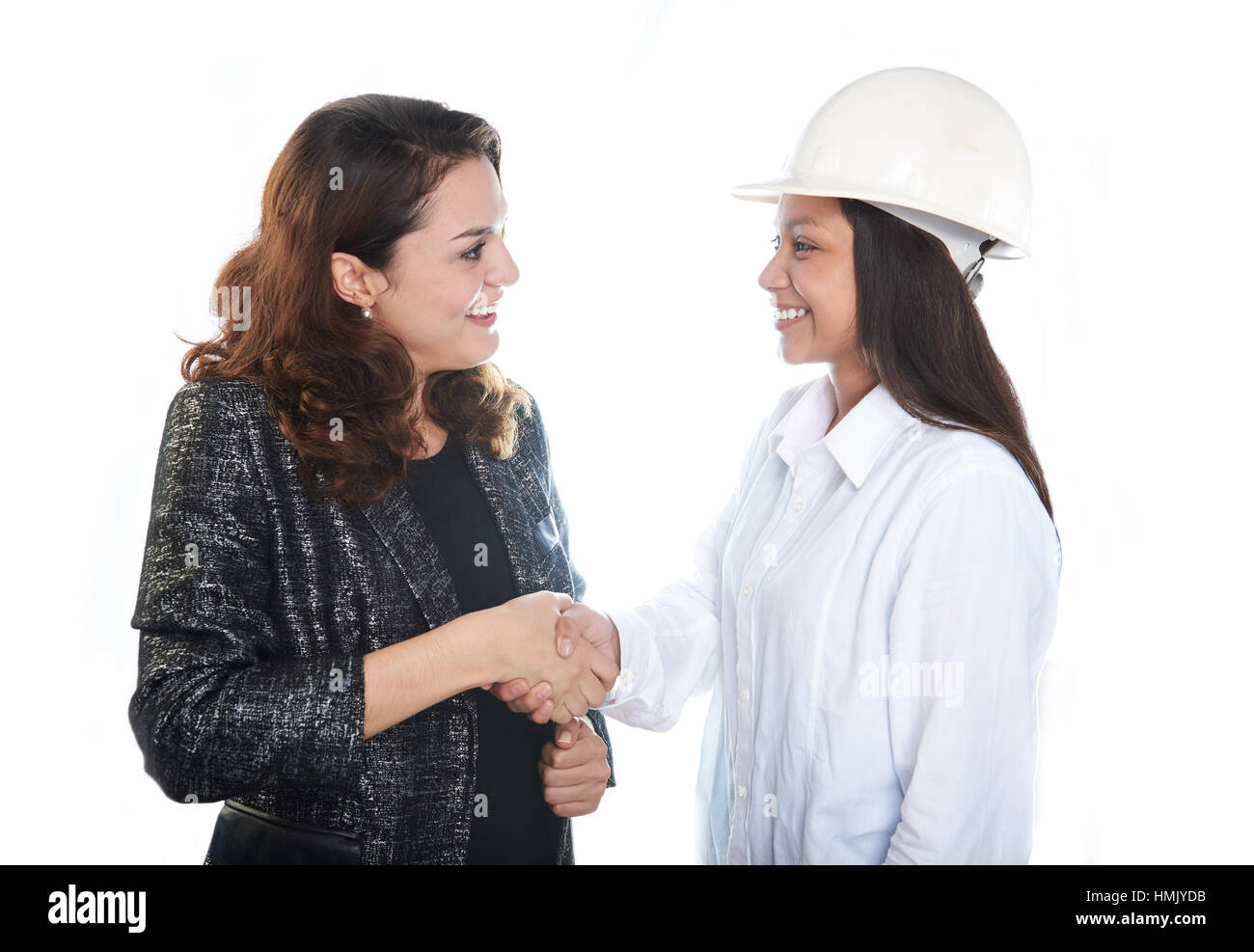 Architecte et constructeur shaking hands on a white background Banque D'Images
