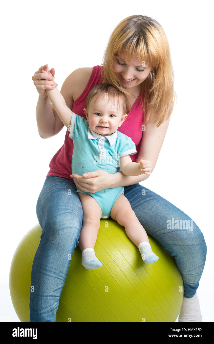 Portrait of happy mother and baby in gym Banque D'Images