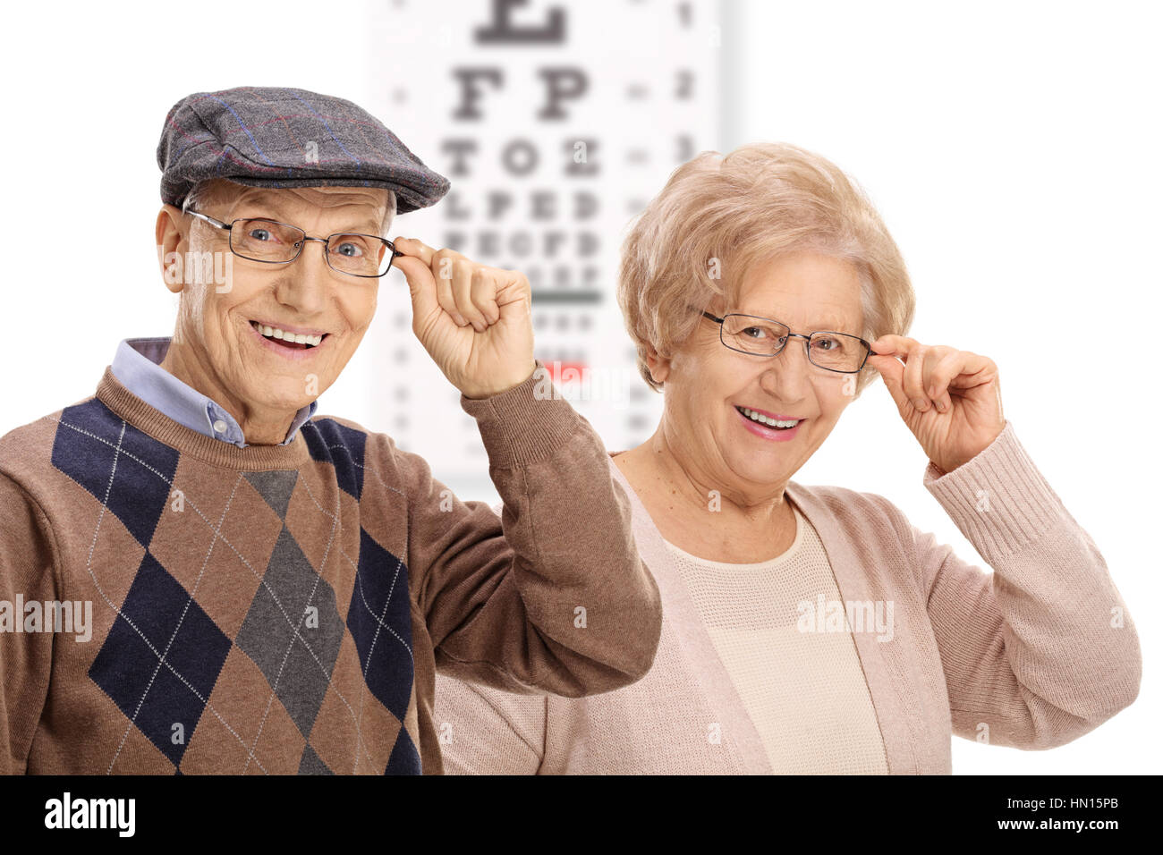 Seniors smiling devant un tableau isolé sur fond blanc Banque D'Images