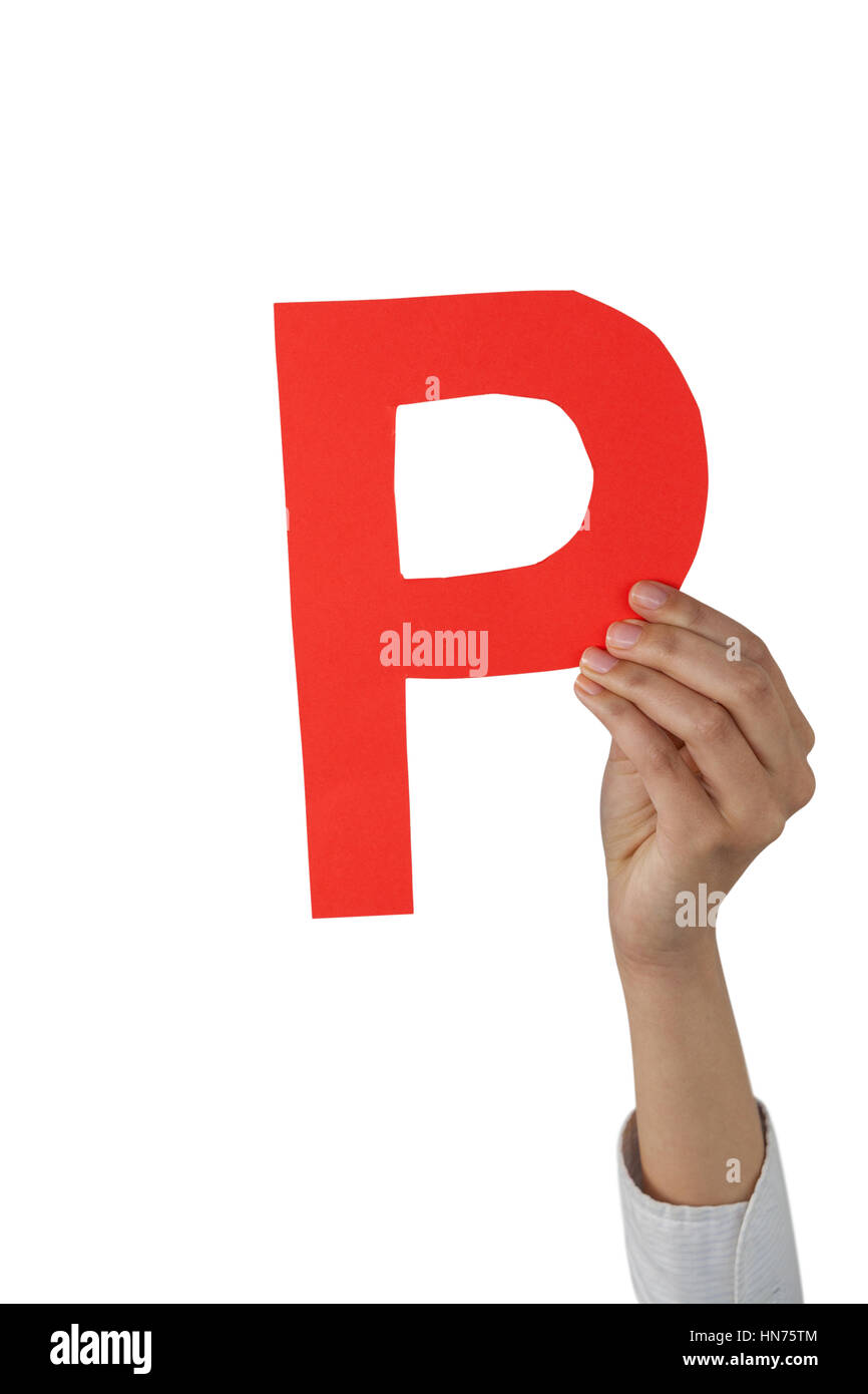 Close-up of businesswoman holding alphabet p against white background Banque D'Images