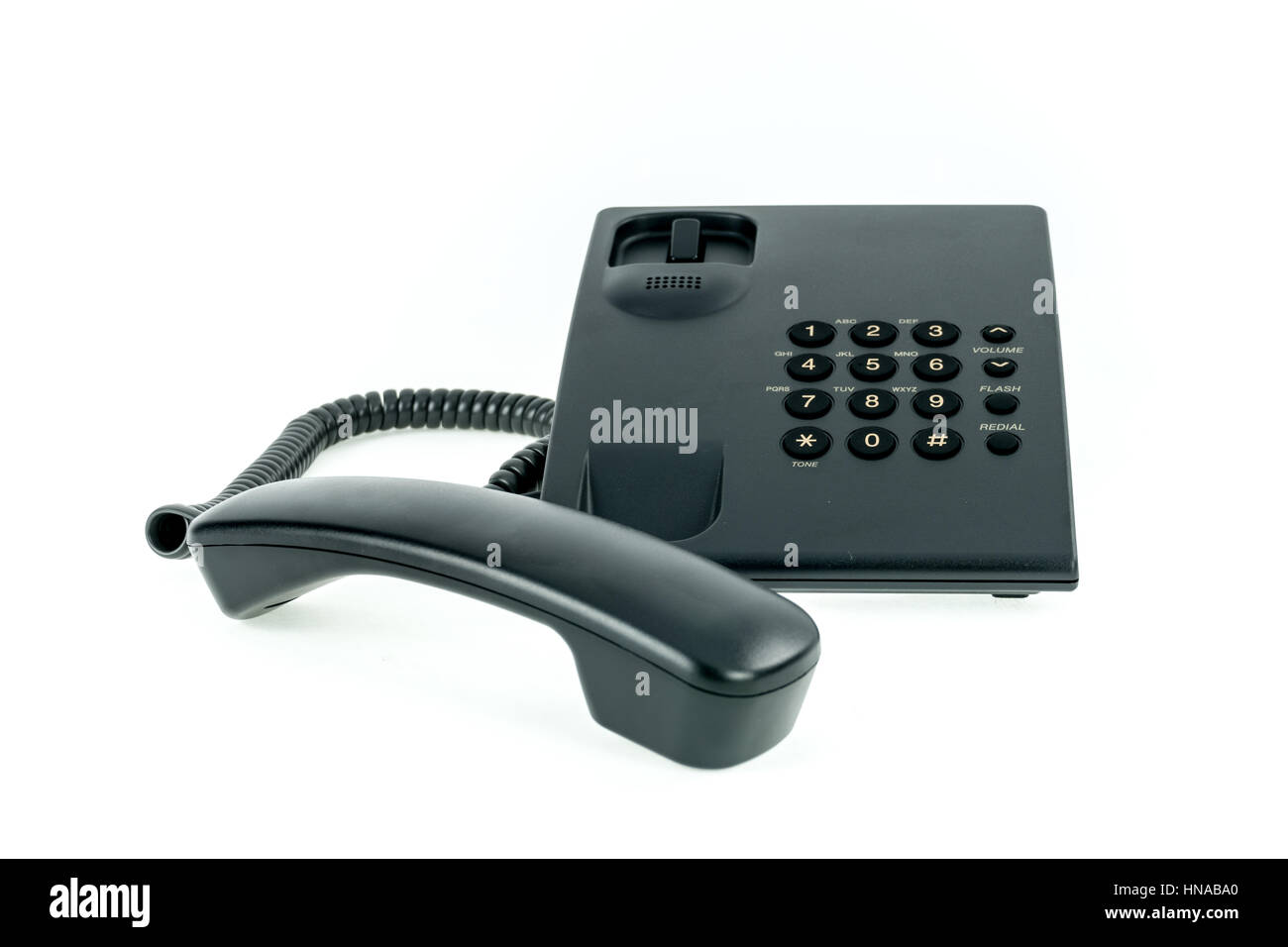 Téléphone de bureau noir combiné avec près de isolé sur fond blanc Banque D'Images