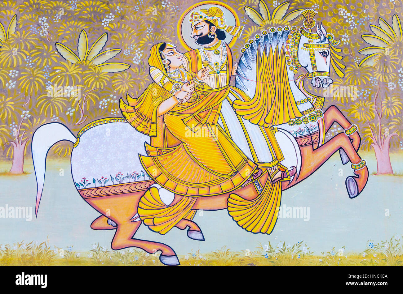 Une fresque à l'extérieur du fort Mehrangarh représentant un roi et reine sur un cheval. Banque D'Images