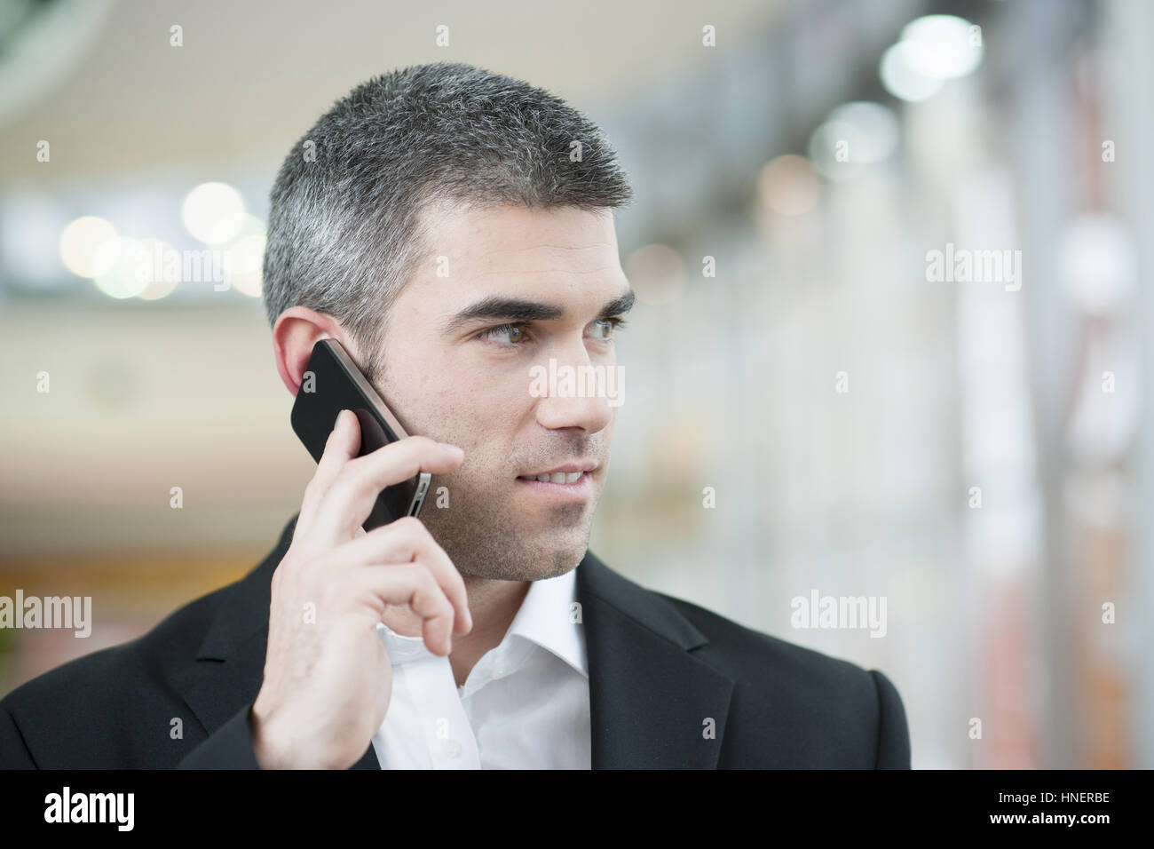 Close-up of businessman on mobile phone Banque D'Images