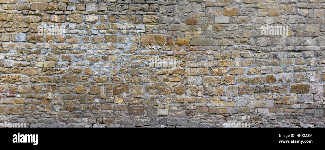 Partie d'un mur de pierre, pour le fond ou la texture. Banque D'Images