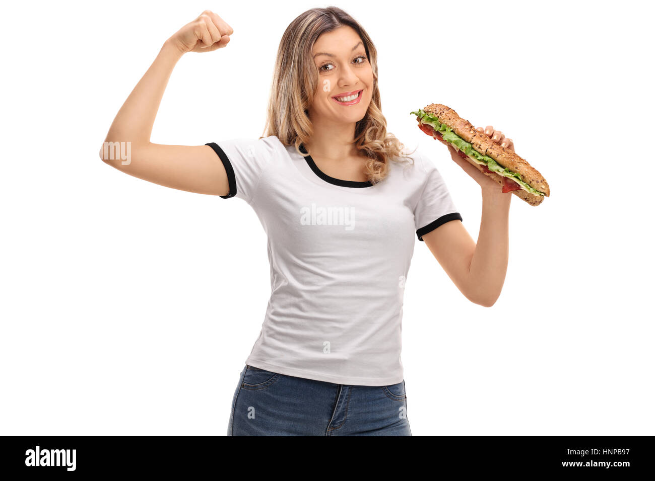 Happy woman flexing ses biceps et la tenue d'un sandwich isolé sur fond blanc Banque D'Images