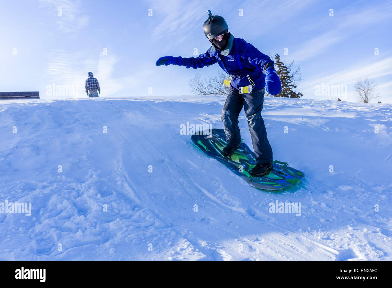 Garçon sur le snowboard, Alberta, Canada Banque D'Images