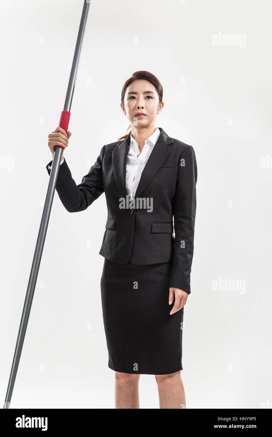 Businesswoman with javelin Banque D'Images