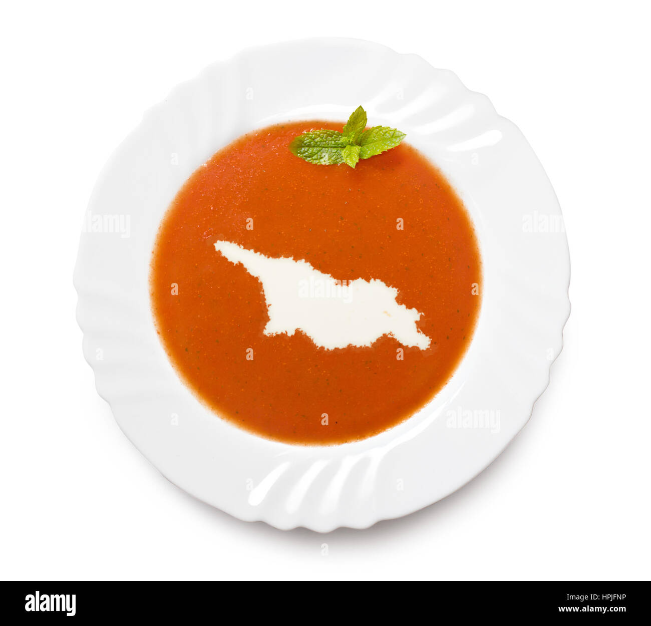 La plaque d'une soupe de tomate avec de la crème en forme de Géorgie.(série) Banque D'Images