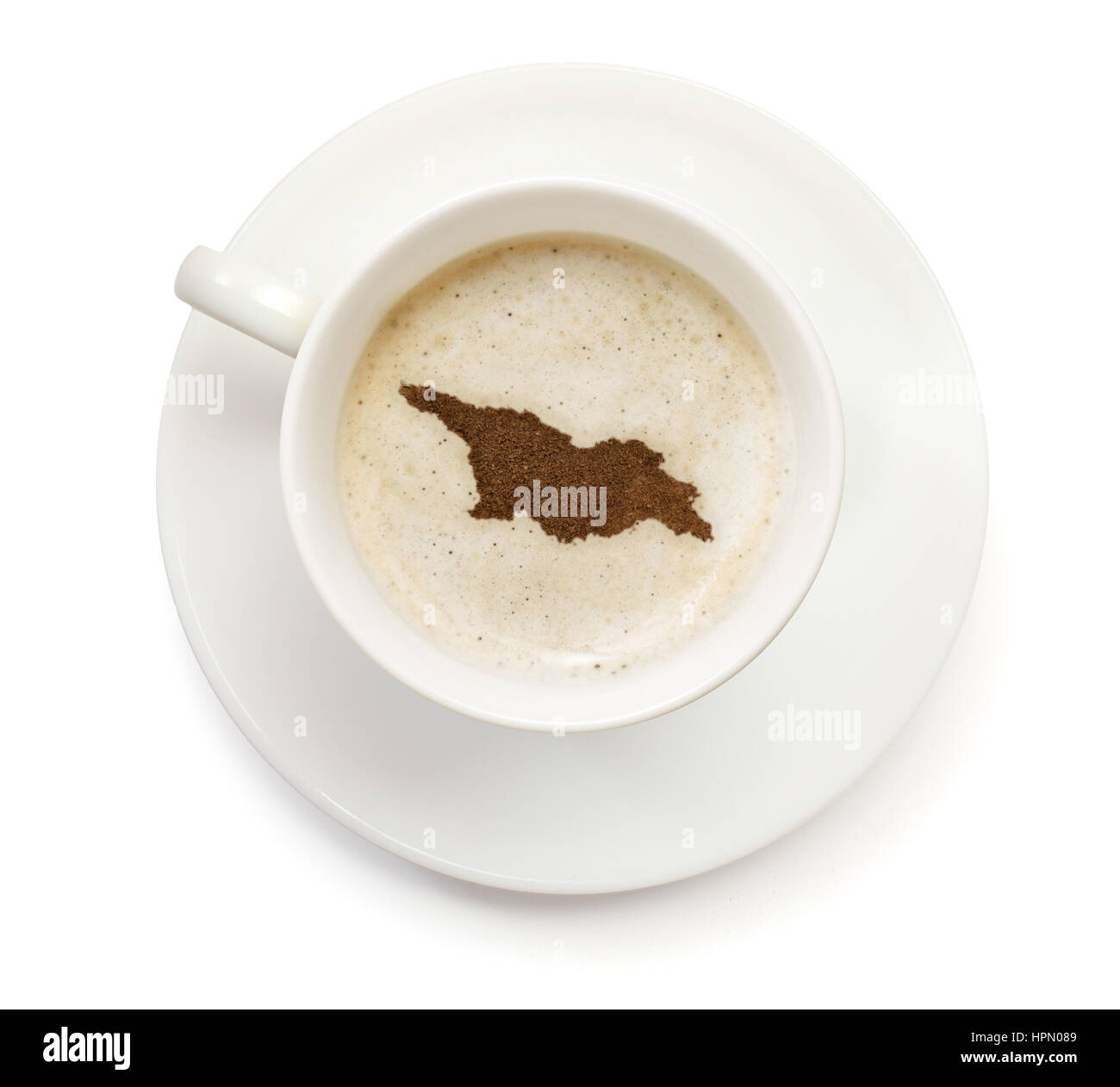 Une tasse de café avec de la mousse et la poudre en forme de Géorgie.(série) Banque D'Images