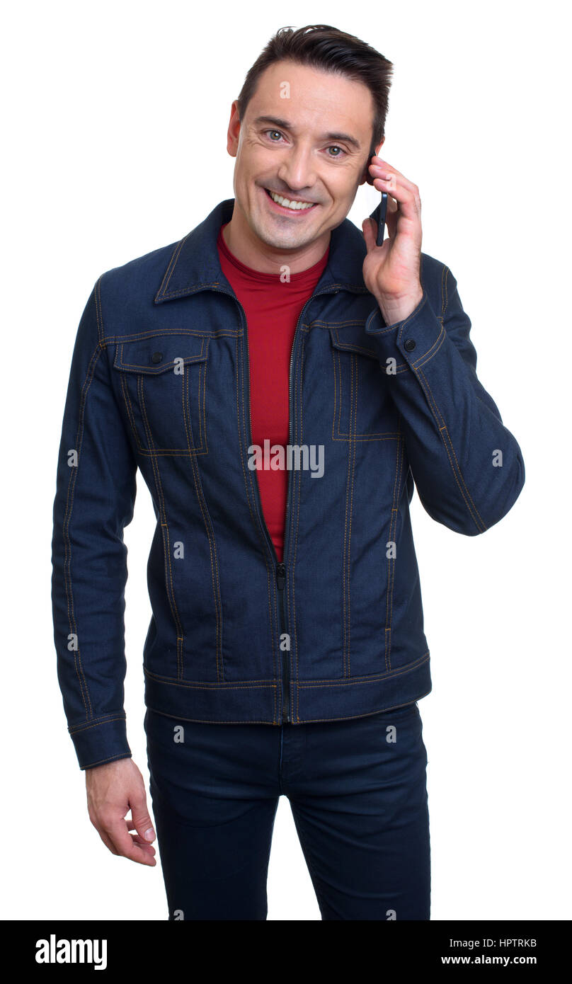 Happy smiling young man talking on mobile phone. Isolé sur fond blanc Banque D'Images