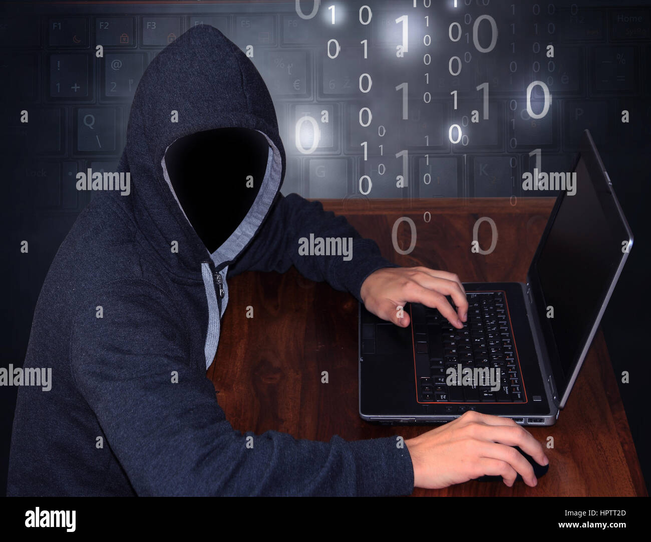 Hacker avec portable Banque D'Images