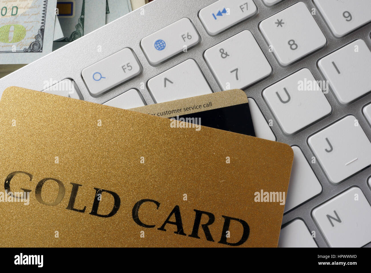 Clavier, nommé carte de crédit Gold Card et devise. Banque D'Images