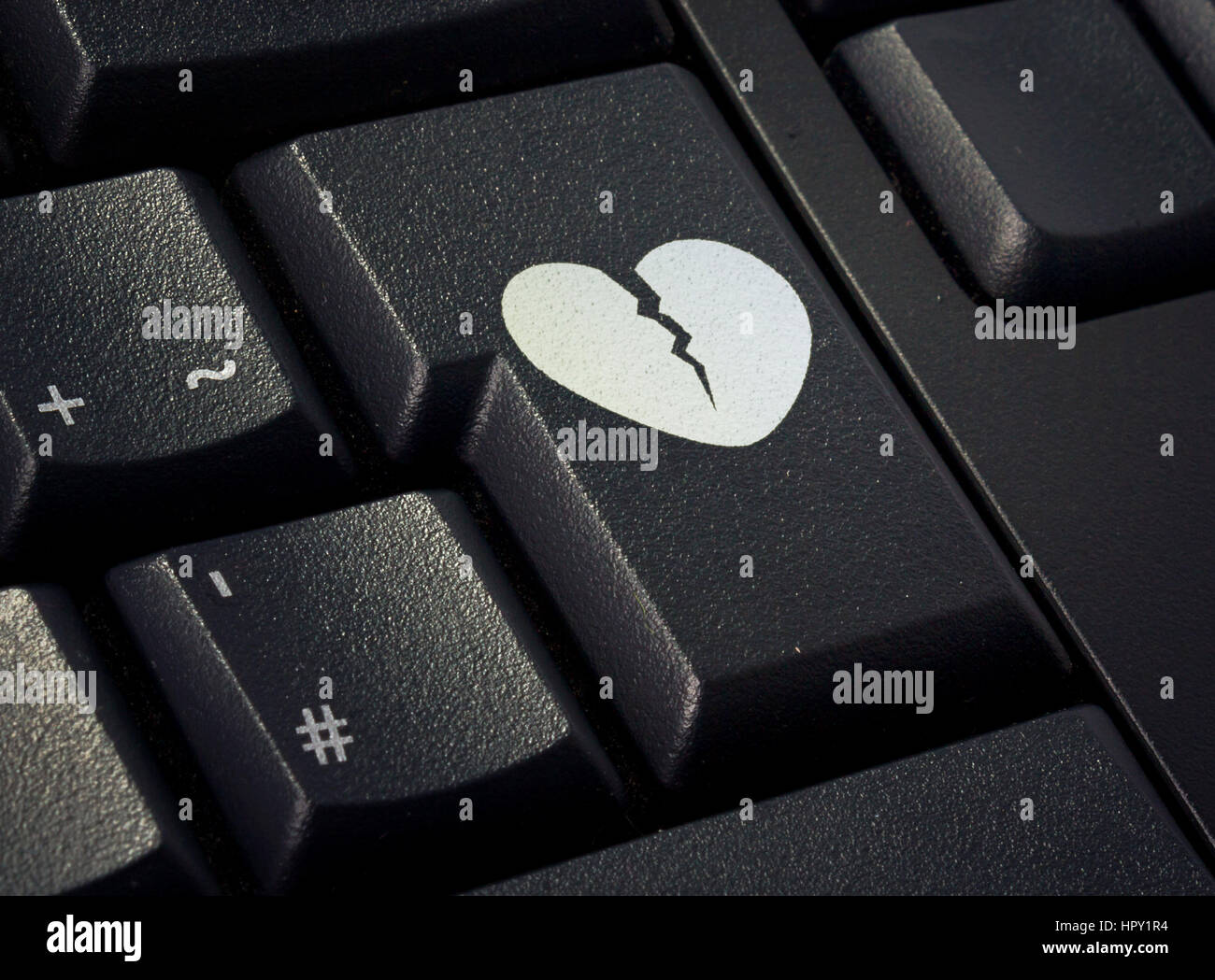 Touche de retour d'un clavier noir avec la forme d'un cœur brisé imprimé  .(série Photo Stock - Alamy