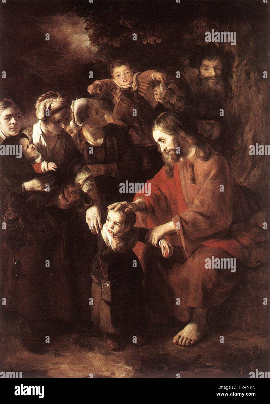 « Christ bénissant les enfants » de Nicolaes Maes est une peinture néerlandaise du XVIIe siècle représentant le Christ entouré d'enfants. La scène souligne la compassion et la bénédiction du Christ, en mettant l’accent sur son expression sereine et le regard attentif des enfants. Cette œuvre d’art religieux reflète les thèmes de dévotion communs à l’époque, soulignant le lien spirituel entre le Christ et la jeunesse. Banque D'Images