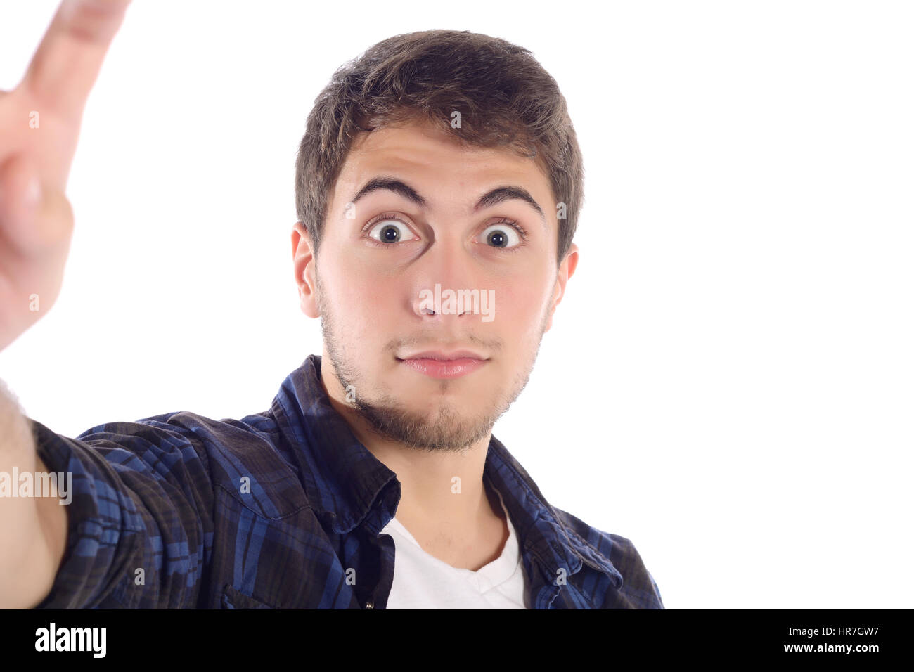 Portrait d'un jeune homme séduisant en tenant un. selfies Isolé sur fond blanc. Banque D'Images