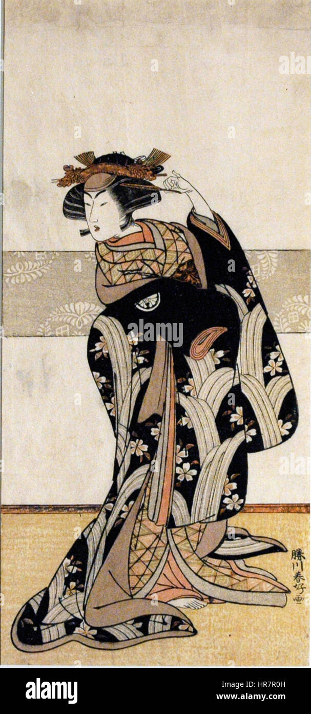 Cette photographie capture Segawa Kikunojo III, un célèbre acteur de kabuki, qui incarne un rôle féminin dans le théâtre traditionnel japonais. Connu pour ses performances habiles, Segawa est célèbre pour incarner des personnages masculins et féminins dans des productions kabuki. Banque D'Images