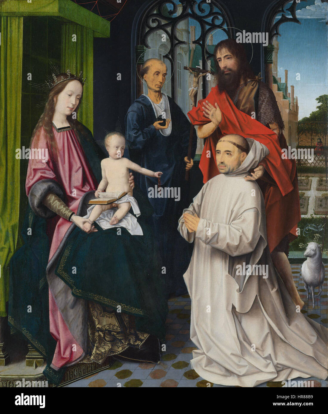 La Vierge et l'enfant ont intronisé, avec Sts Jerome et Jean le Baptiste et un Chartreux agenouillé par Jan Provoost (1465 - 1529) attribué Banque D'Images